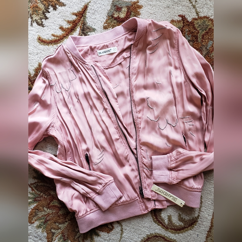 Never worn! New with tags!Women's pink silky jacket with floral design